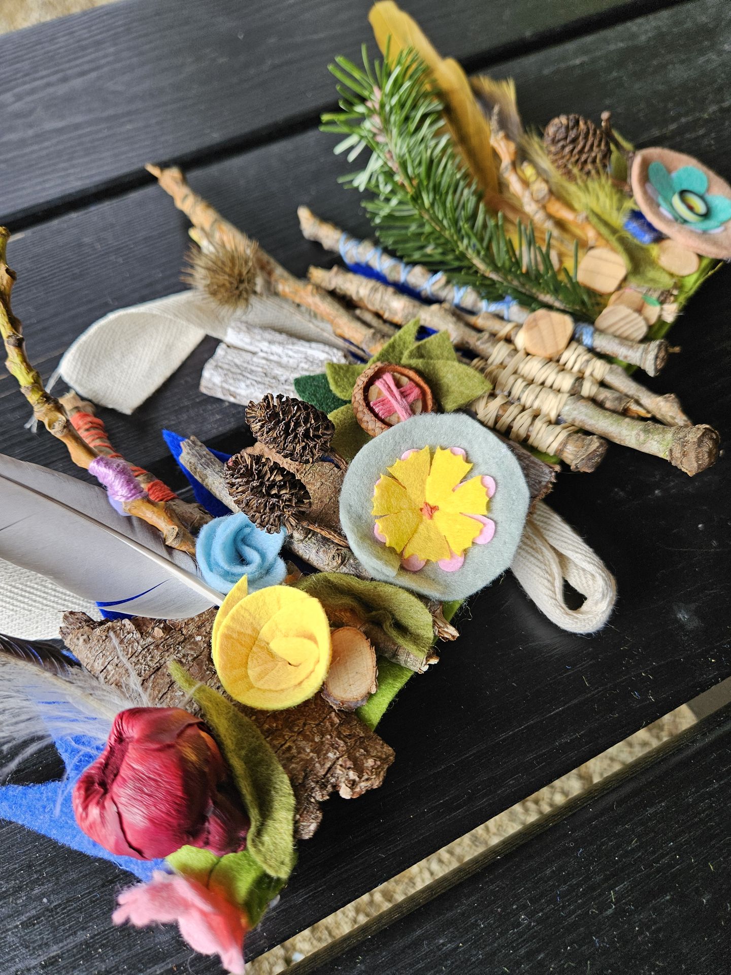 a crown made from natural materials and wool felt flowers